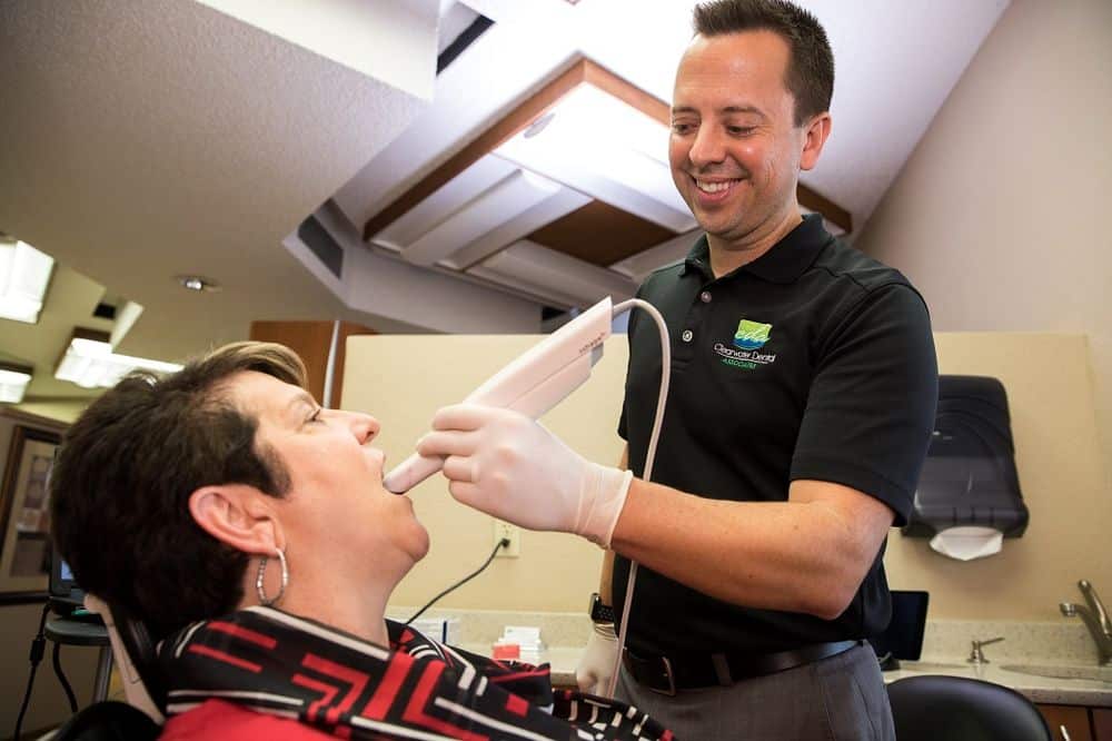 Dr metthew burton attending a teeth whitening patient