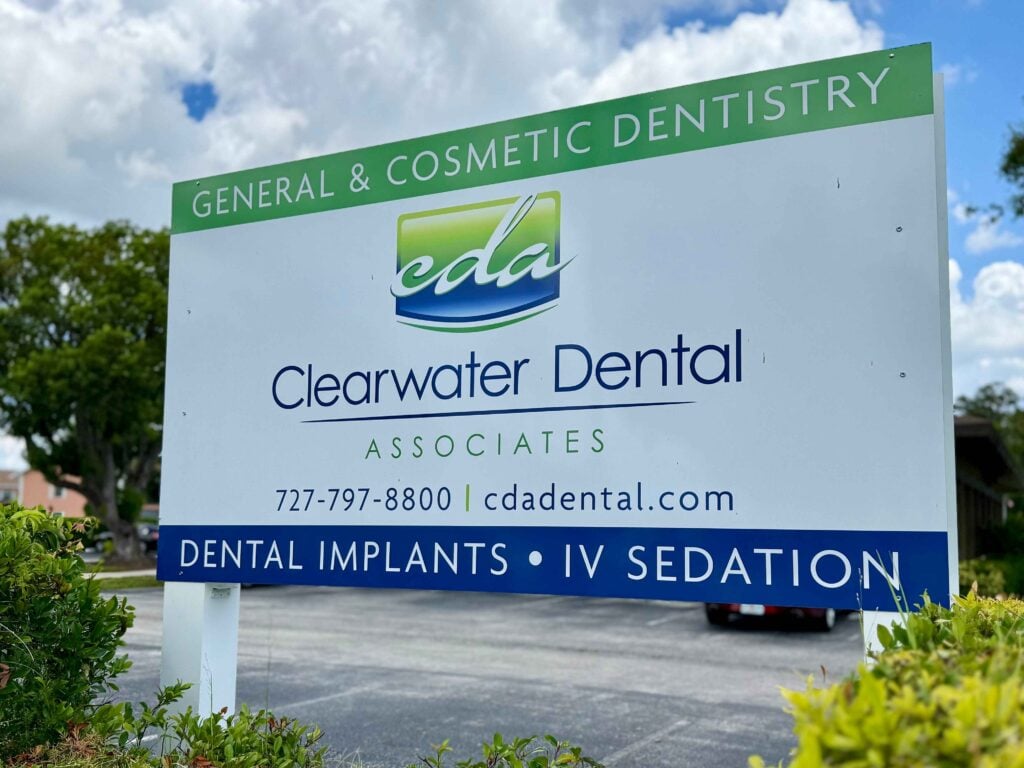 Clearwater Dental Associates signboard highlighting cosmetic dentistry and advanced dental care in Clearwater, Florida.